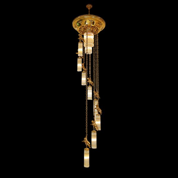 A long brass chain chandelier with cherub statues and crystal beads on black background, full view.