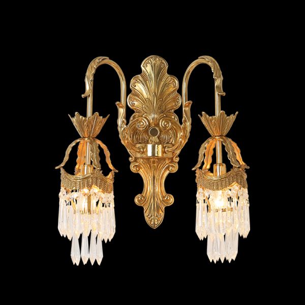 Front view of the Versailles Cascade brass wall sconce with crystal fringes on a black wall, JEWELLERY TOP.