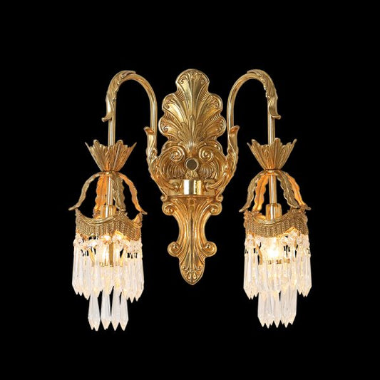 Front view of the Versailles Cascade brass wall sconce with crystal fringes on a black wall, JEWELLERY TOP.