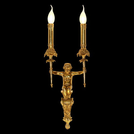 Front view of the Eros' Embrace brass wall sconce with a central cherub sculpture and two candle lights on a dark background.