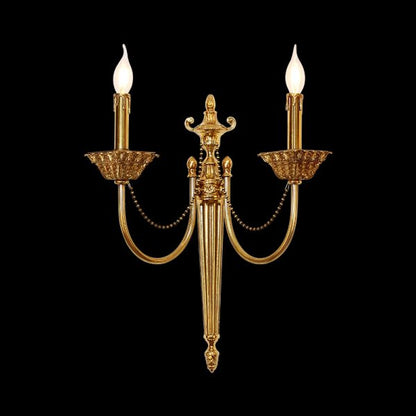 Cygne Royal dual-arm brass wall sconce with candle bulbs and bead chains on black, JEWELLERY TOP.
