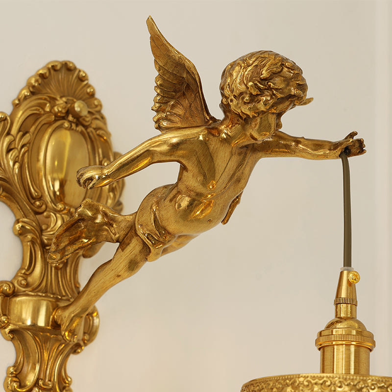Extreme macro close-up of the golden Cupid sculpture, showcasing its wings, flowing hair, and dynamic posture.