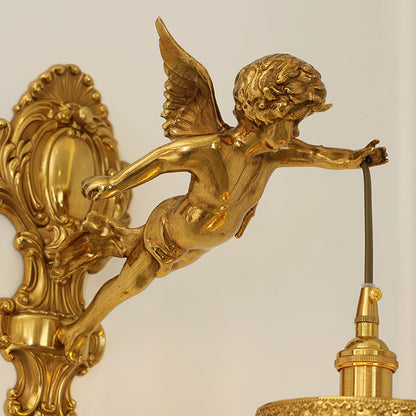 Extreme macro close-up of the golden Cupid sculpture, showcasing its wings, flowing hair, and dynamic posture.