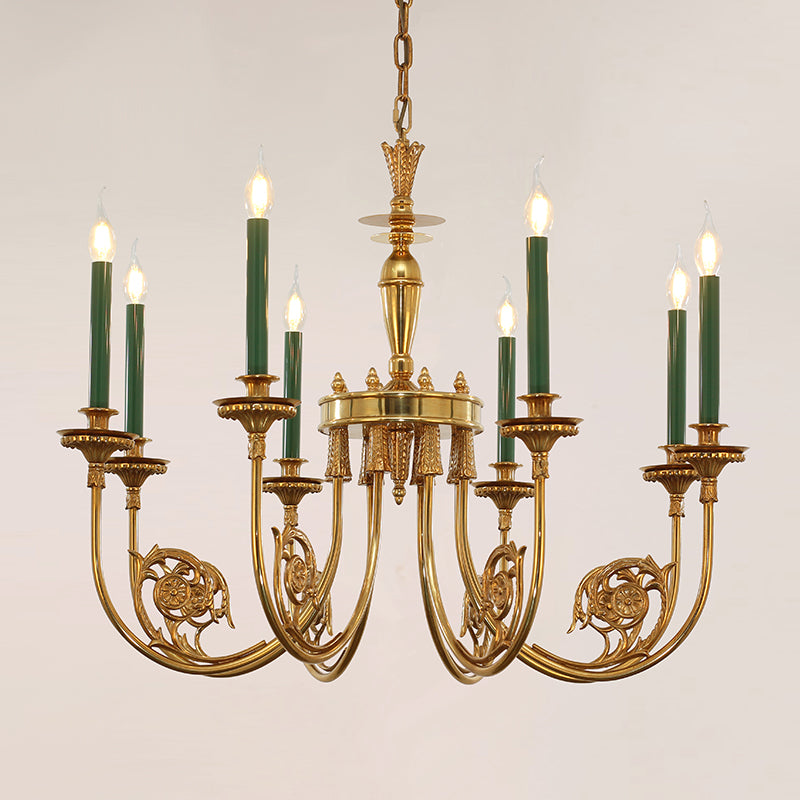 Ornate brass chandelier with multiple green candle lights against a clean white background.