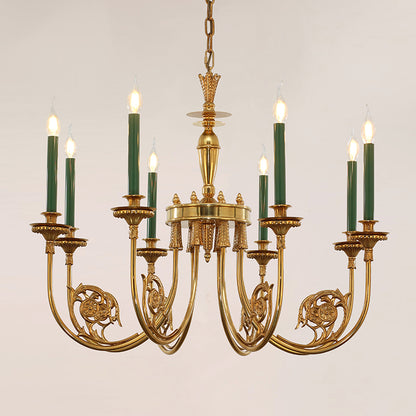 Ornate brass chandelier with multiple green candle lights against a clean white background.