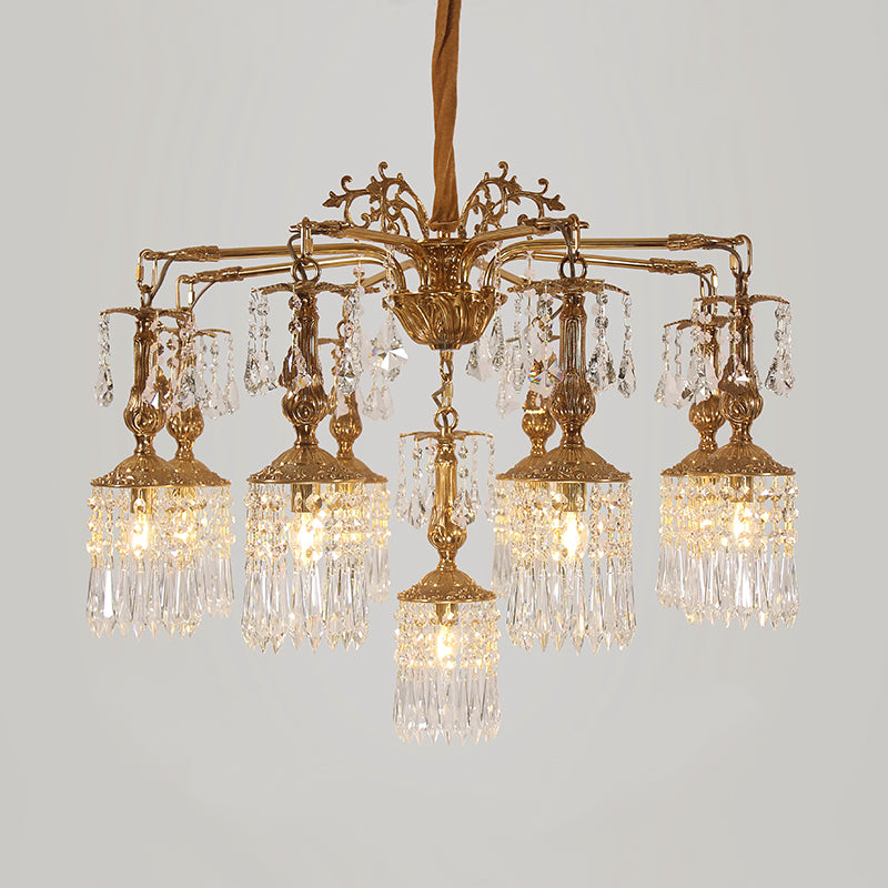 Macro close-up of the finely detailed golden acanthus leaves and the precision-cut crystal teardrop pendants.
