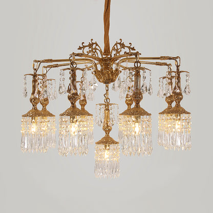 Macro close-up of the finely detailed golden acanthus leaves and the precision-cut crystal teardrop pendants.
