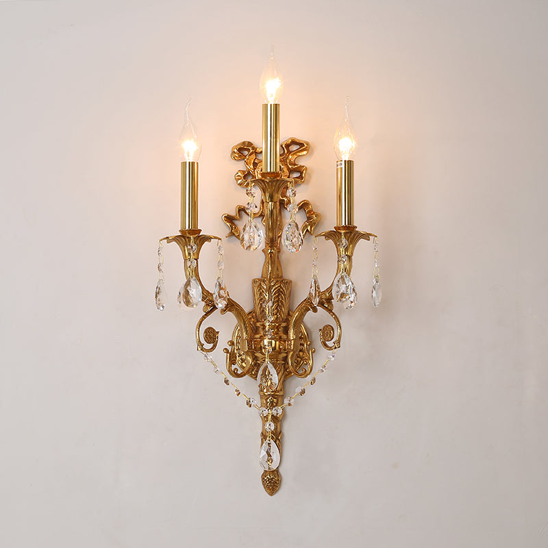 Side profile view of the three-arm wall light, highlighting its elegant proportions and warm glow.