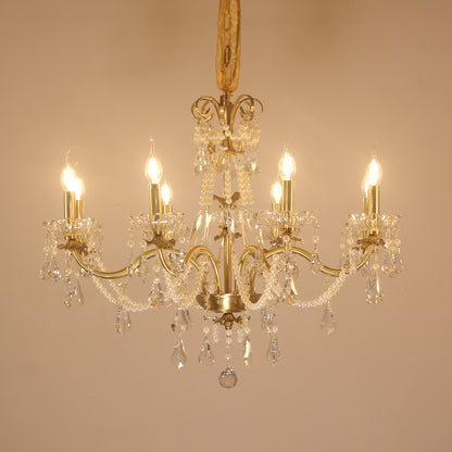 JEWELLERY TOP brand's luxury crystal chandelier showcasing elaborate acanthus scrolls and cascading crystal strands.