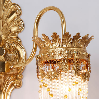 Front view of the vintage French wall light, showcasing its symmetrical design and opulent decorative details.
