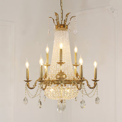Front display of a luxurious brass chandelier with candle bulbs and sparkling prisms.