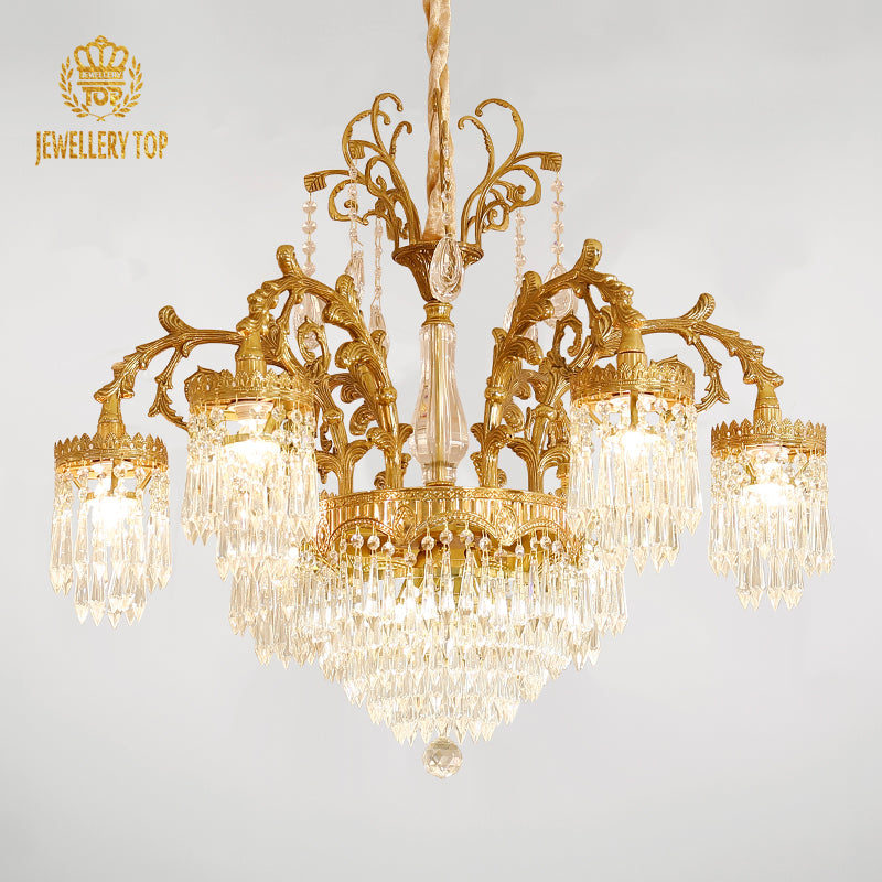 JEWELLERY TOP brand's ornate brass and crystal chandelier on a white background.