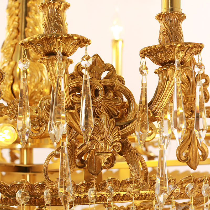 Sparkling crystal prisms and gilded arms of a magnificent vintage chandelier.