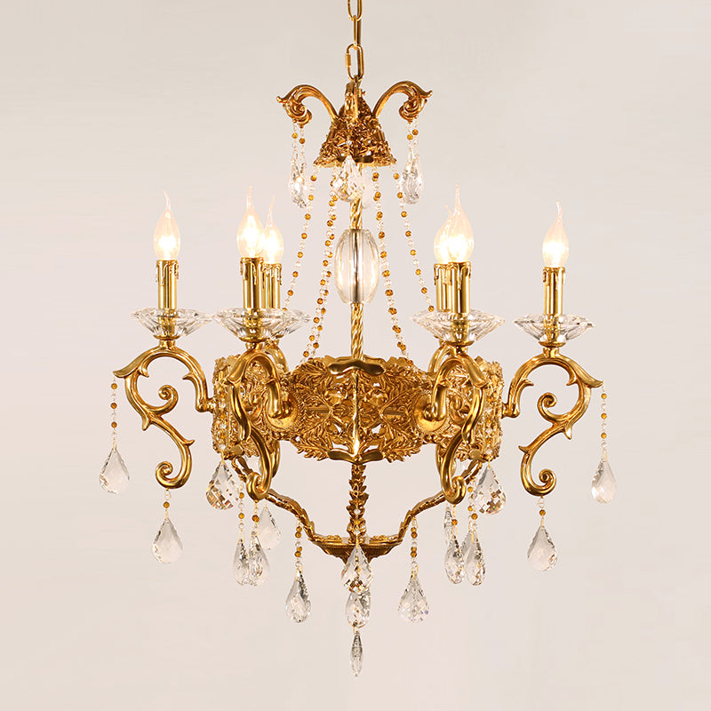 Macro close-up of the finely detailed golden scrollwork and the precision-cut crystal teardrop pendants.