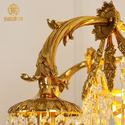 Extreme macro shot of intricate brass rope detail and hanging crystal strings on the chandelier.