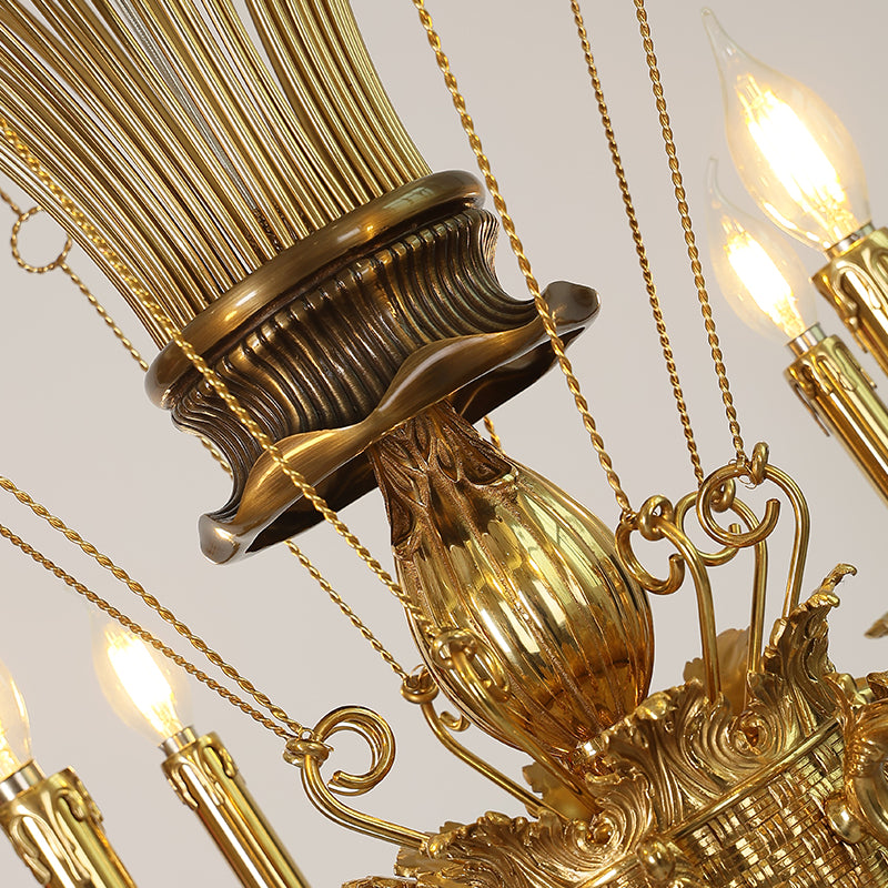 Close-up detail of the ornate brass onion-shaped base and hanging chains on the chandelier.