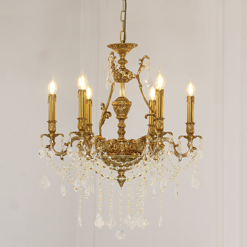 Front view of a luxury brass chandelier with candle bulbs on a white background.