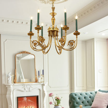 Golden brass chandelier installed in an elegant living room with a white fireplace and blue sofa.