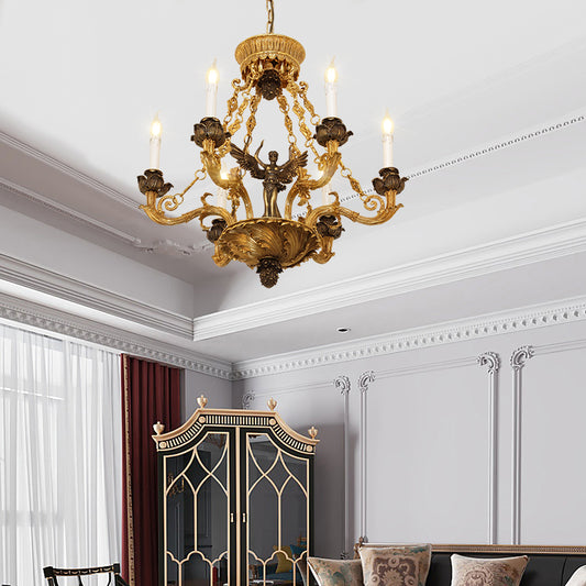 French brass living room chandelier installed on a decorative ceiling with gray paneled walls.