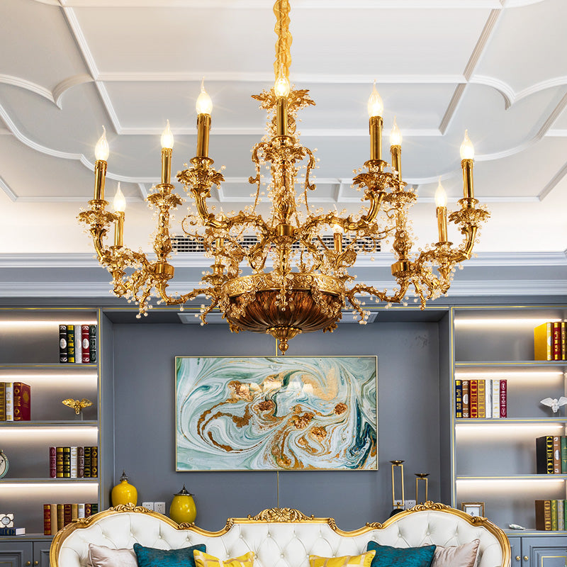 A European classical brass chandelier installed in a luxurious living room with abstract art and bookshelves.