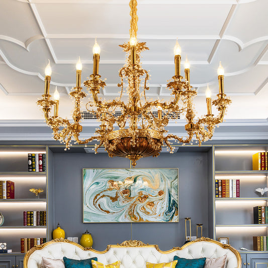 A European classical brass chandelier installed in a luxurious living room with abstract art and bookshelves.