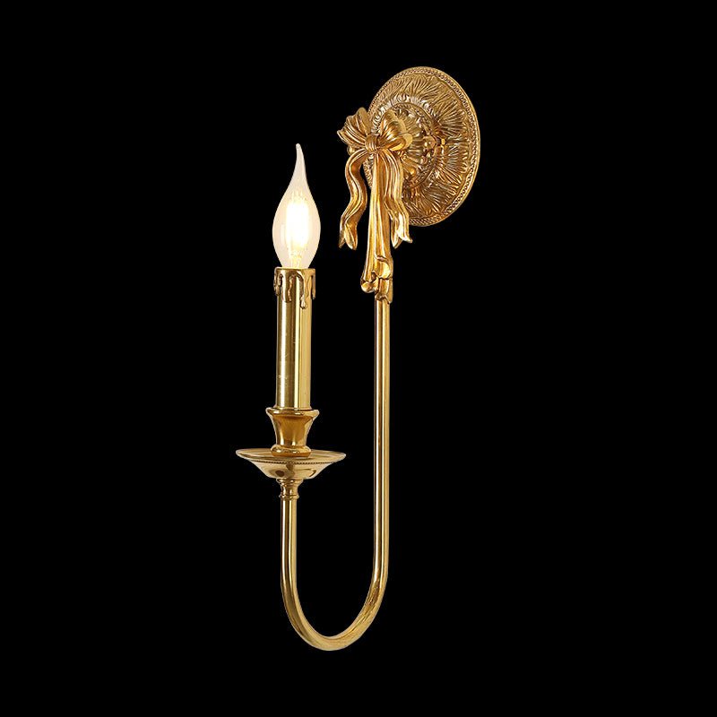 Golden Noeud d’Or brass wall sconce with a ribbon bow on a black background, JEWELLERY TOP brand.