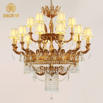 Close-up detail of a JEWELLERY TOP brass chandelier with ornate metalwork and fabric shades.