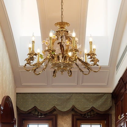 French brass ceramic flower chandelier installed in a room with green curtains and cabinets.