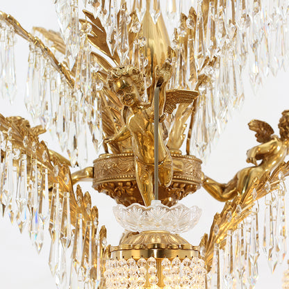 Extreme close-up of a detailed brass cherub figurine and crystal pendants on the chandelier.