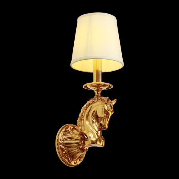 Close-up front view of the Chevalier d’Or brass horse head wall sconce with a white fabric shade on a black background.