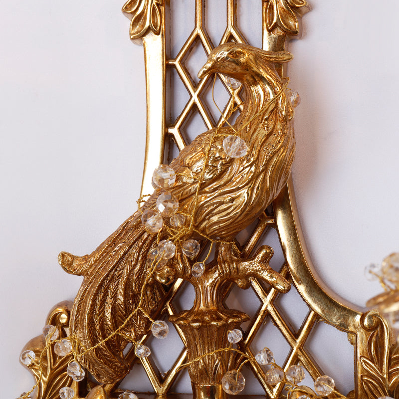 Extreme macro detail of the phoenix sculpture, showcasing its textured feathers, beak, and perched pose on a base.