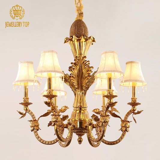 Wide angle view of the luxury decorative chandelier illuminating an elegant dining room with classic French decor.