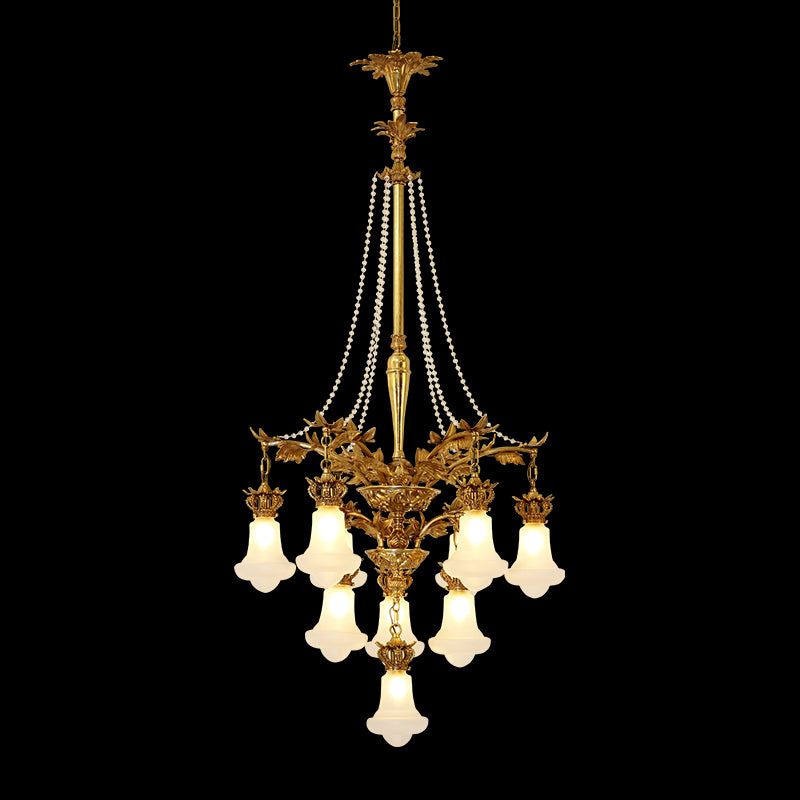 Couronne de Perles Impériale brass chandelier with pearl strands and white shades on black.