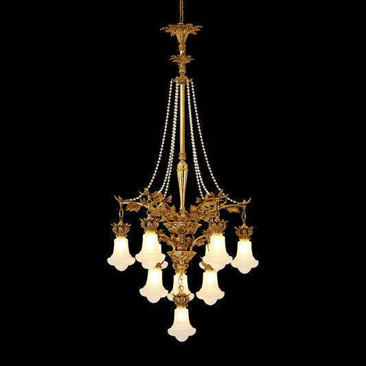 Couronne de Perles Impériale brass chandelier with pearl strands and white shades on black.