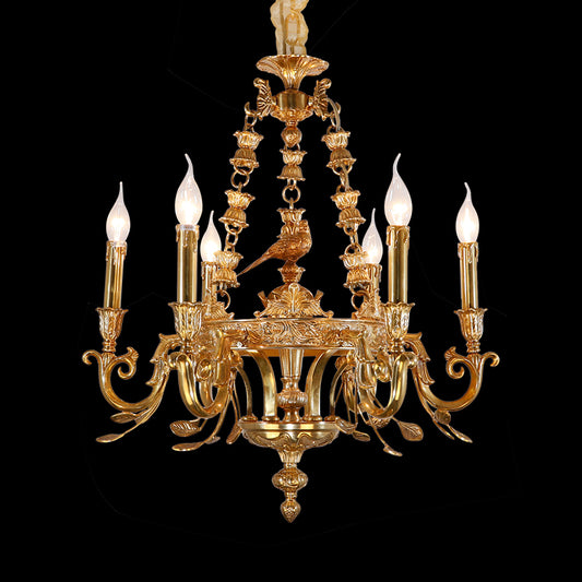 Close-up of Oiseau d'Éternité brass chandelier with bird figurine and white shades on black.