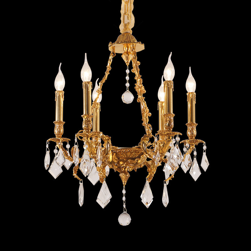 Ivy & Oak Victorian brass chandelier with crystal drops and candle bulbs on black background.