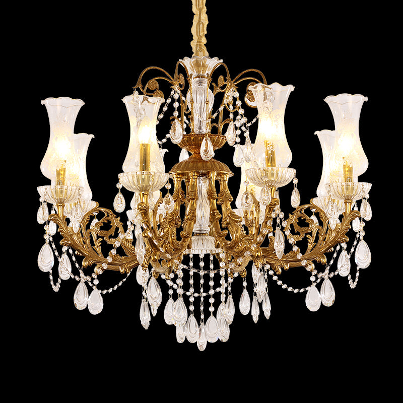 Full view of the Versailles Crystal Palace european brass chandelier with multiple glowing lights against a black background.