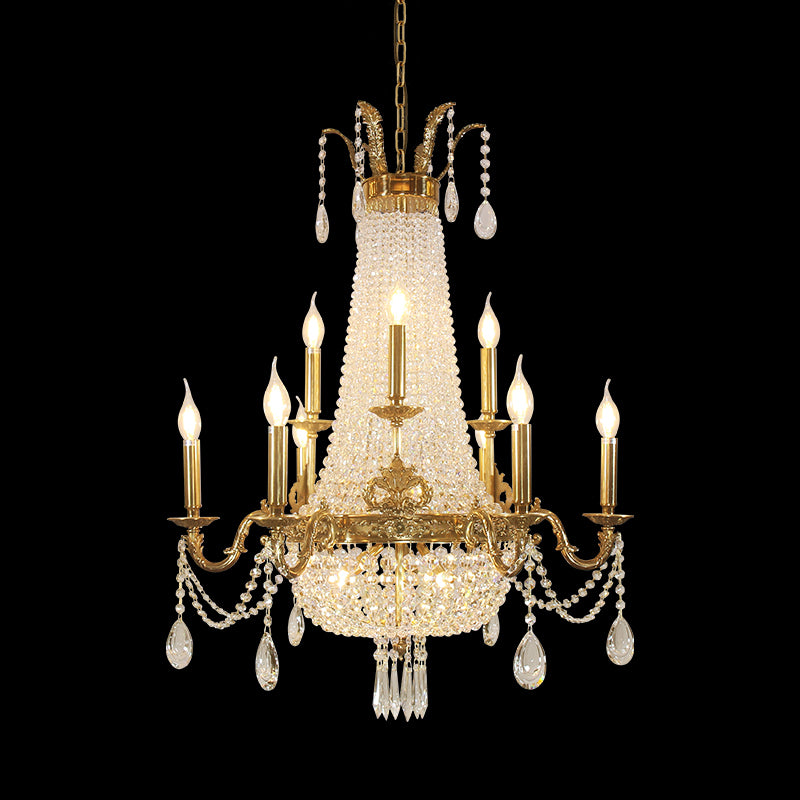 The crystal decorative brass chandelier showcasing its symmetrical arms and layered crystals.