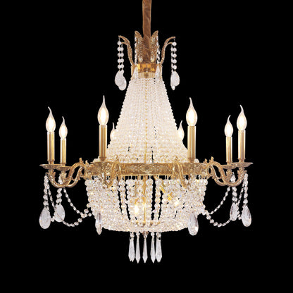 Detailed side perspective of the ornate brass and crystal hotel lobby chandelier.