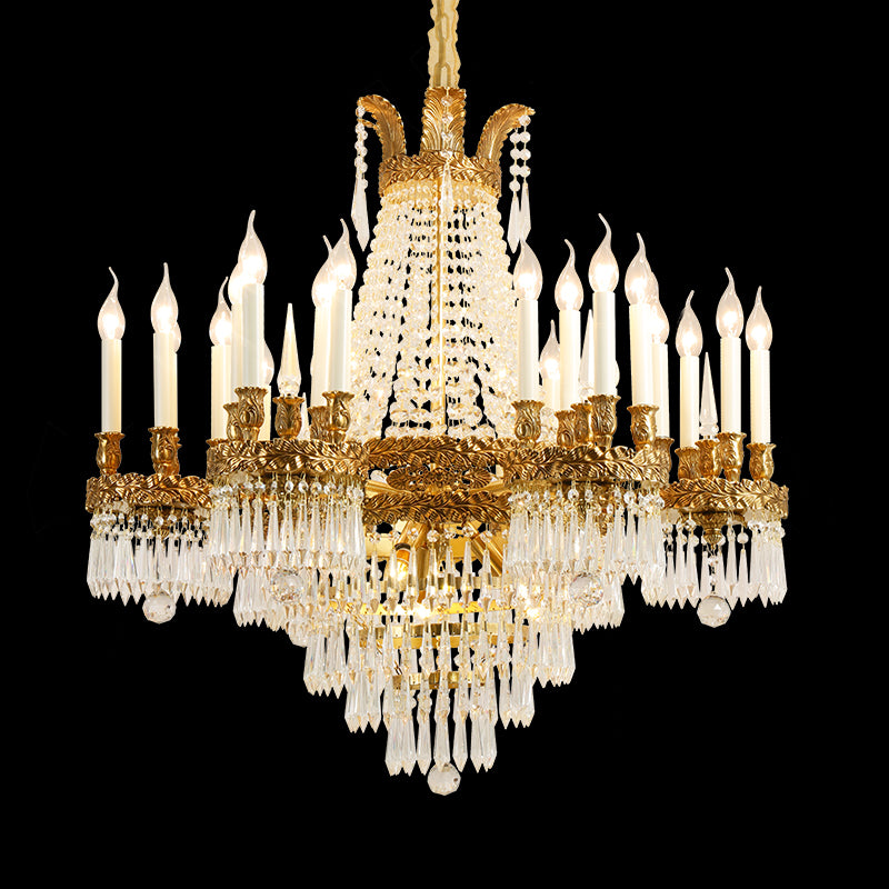 Palais Royal Couronne brass crystal chandelier with layered tiers, isolated on black background.
