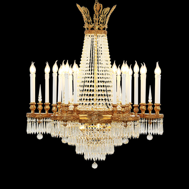 A multi-tiered luxury brass chandelier with crystal curtains and candle bulbs, front view.
