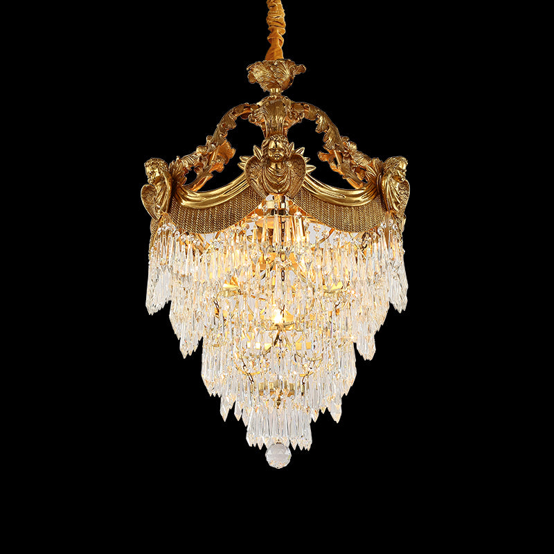 Full studio shot of the French Louis XVI cherub motif K9 crystal brass chandelier glowing against a stark black background.