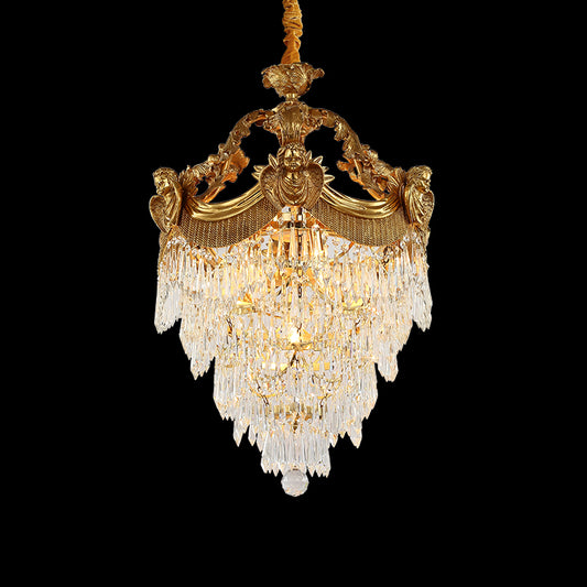 Full studio shot of the French Louis XVI cherub motif K9 crystal brass chandelier glowing against a stark black background.
