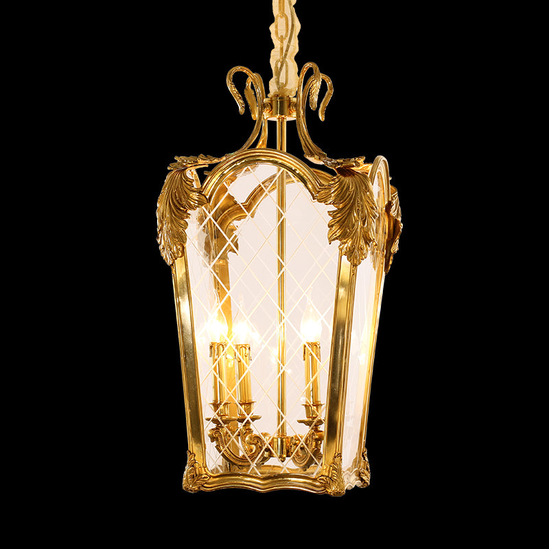 A vintage french brass pendant light with candle bulbs, showcased against a black background.