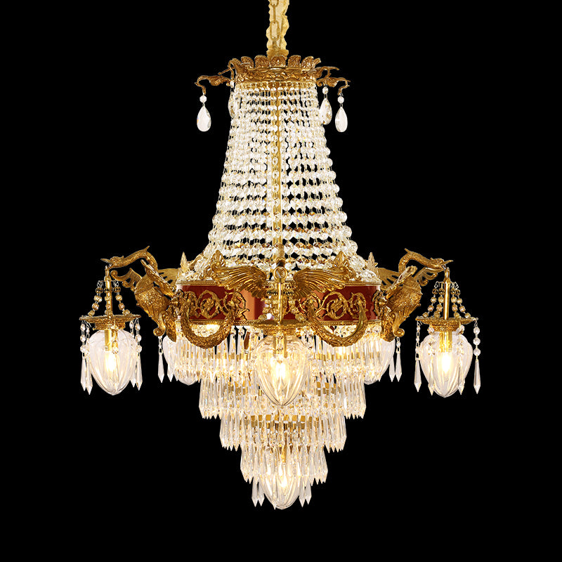 Close-up detail of ornate brass animal and crystal beads on a luxury chandelier.