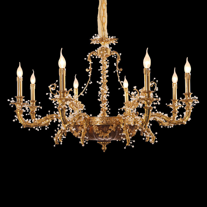 Detailed perspective of a French-style brass chandelier with multiple arms and glass bead decorations.