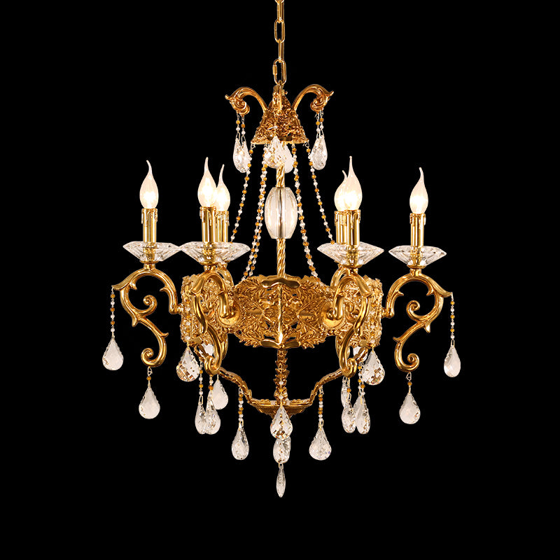 A luxury chandelier installed in a bright, airy conservatory with large windows overlooking a scenic view.