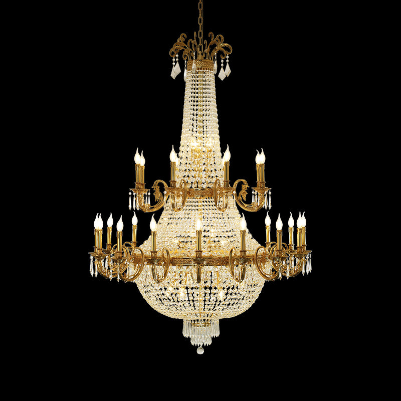 A large size chandelier installed in a grand residential living room with a high ceiling, elaborate crown molding, and classical wall art.