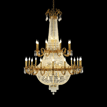 A large size chandelier installed in a grand residential living room with a high ceiling, elaborate crown molding, and classical wall art.