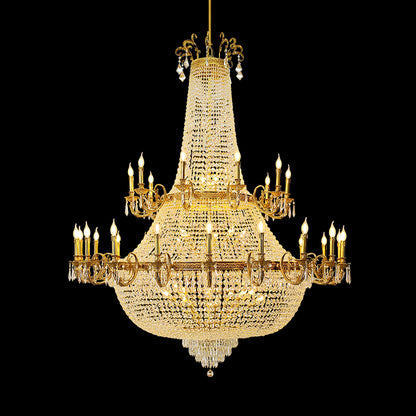 Full-length studio shot of the French Royal Versailles Crystal Column brass chandelier glowing against a stark black background.
